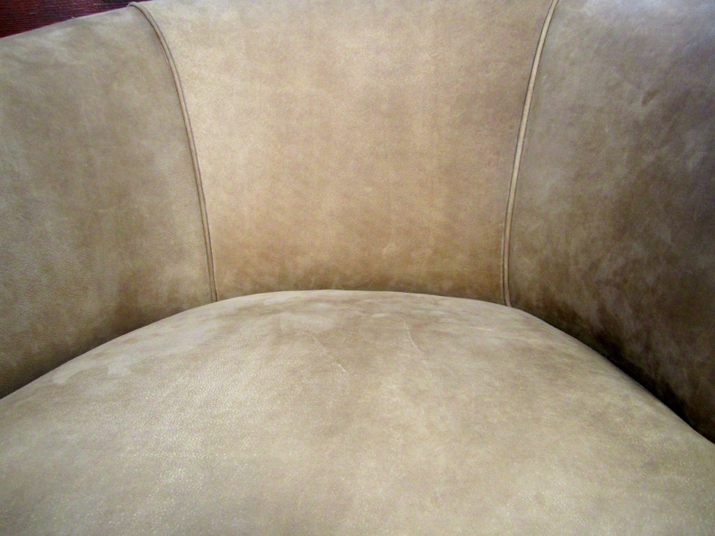 Newly upholstered with suede-like leather hide.  Accented with nail heads.  seat is 22