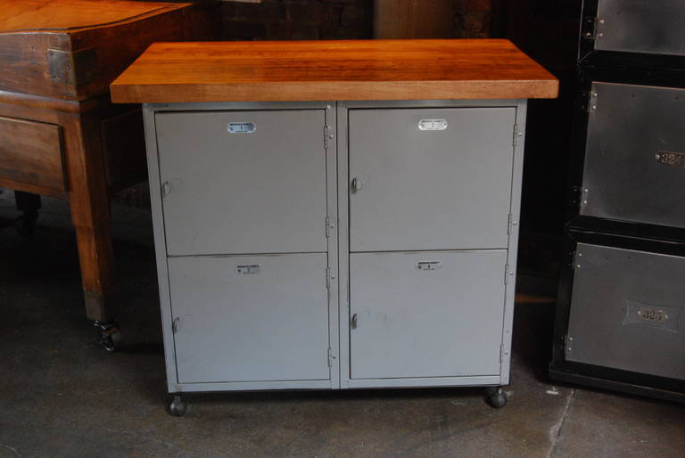 Four locker compartments, with butcher block top and ball feet. Very sweet piece, use anywhere. Meticulously finished.