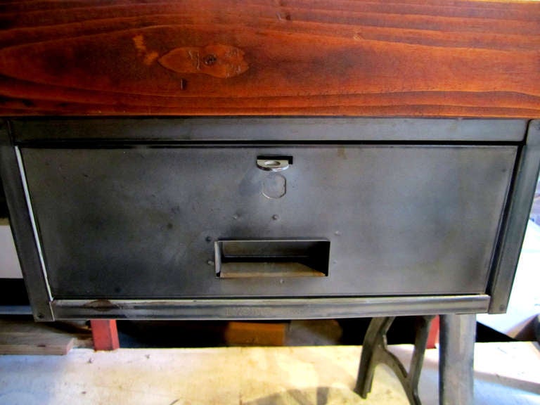 Fabulous industrial table which allows use as an island, desk or work table.  Also great for retail display.  Cast iron legs from a late 1800's- early 1900's lathe, manufactured in ROCKFORD ILL USA.