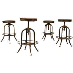 A Set of Four Toledo and Company Industrial Metal Stools