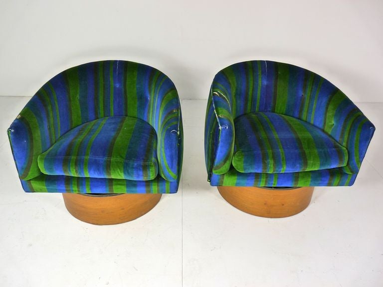 Pair of Milo Baughman for Thayer Coggin swivel lounge chairs. Chairs sit on high tilt and swivel base.  Chairs are petite but very comfortable.