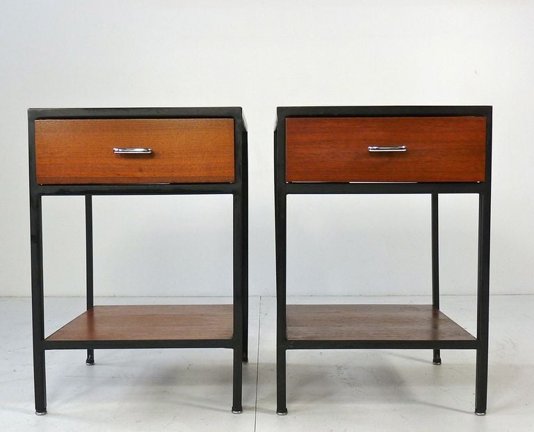 George Nelson for Herman Miller Steel frame nightstands. Simple architectural design.  Steel frame, walnut drawer front and shelf, painted drawer sides and white laminate top.