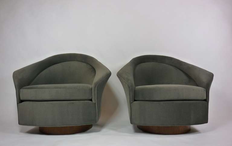 Pair of tilt and swivel lounge chairs by Adrian Pearsall. Walnut bases. Newly upholstered in in dark grey mohair velvet.