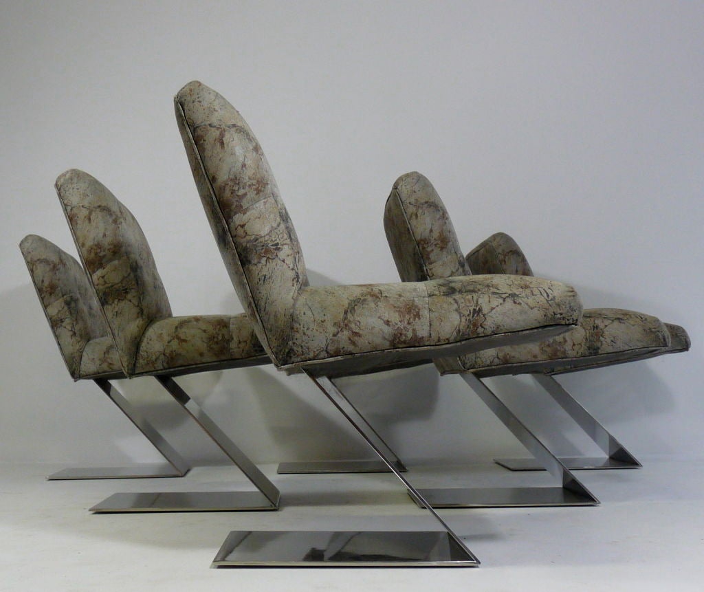 Rare set of six cantilevered Milo Baughman chairs on polished steel bases.