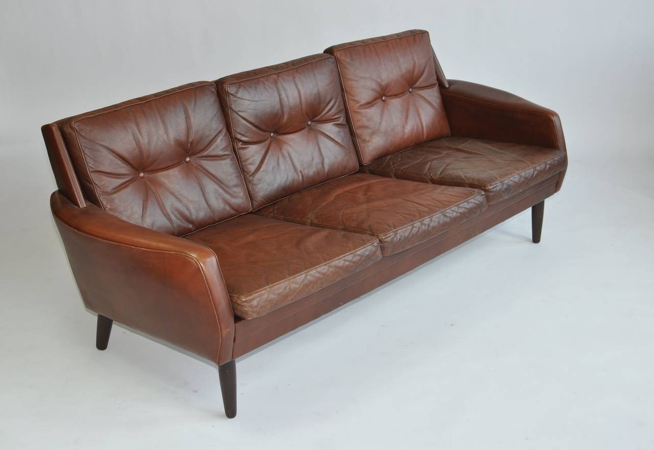 Danish leather sofa with teak legs.