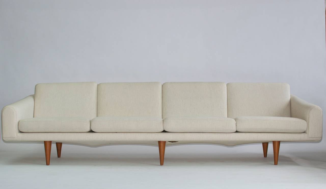 Illum Wikkelsø sofa. Round tapered solid teak legs. Recently upholstered. Wool fabric.
