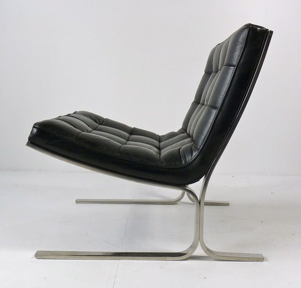 Nicos Zographos black leather lounge chair.