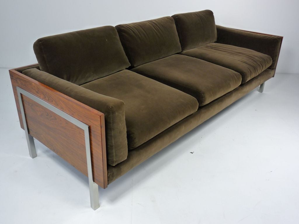 Exceptional rosewood sofa with polished steel sides. Beautiful rosewood grain.