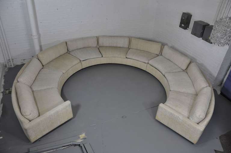 Milo Baughman circle sofa with rosewood base.