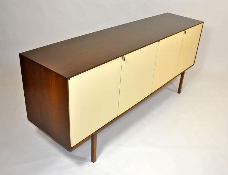 Florence Knoll Walnut Credenza with original white Lacquered Doors.