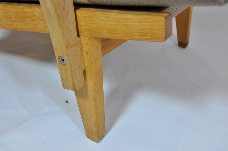 Oak Pair of Wide Arm Lounge Chairs and Ottoman by Hans Wegner