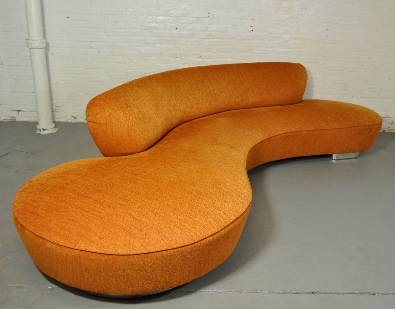 Vladimir Kagan serpentine sofa. Chrome base.