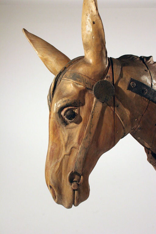 A superb example of France's best known carousel carver, Gustave Bayol, from his studio in in Angers, France. The head hangs from a hook inside the donkey's body, which allows it to nod.