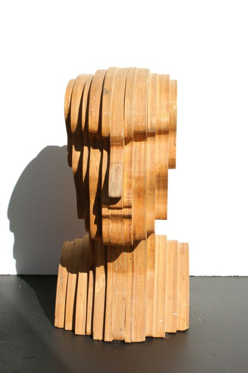 This stacked plywood Folk Art piece showcases the unique vision of its creator. An intriguing sculptural piece from every angle.