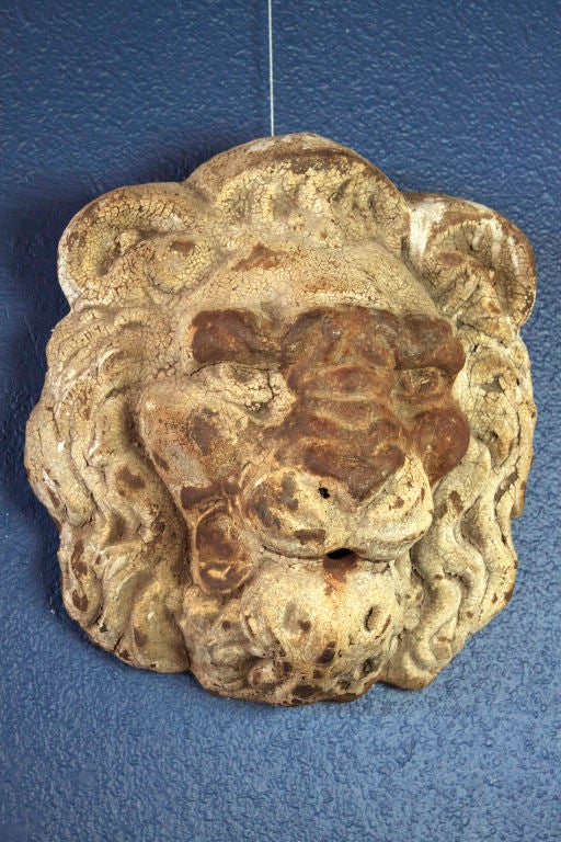 This cast iron lion head, with its original paint surface, once adorned a building in the Midwestern US.