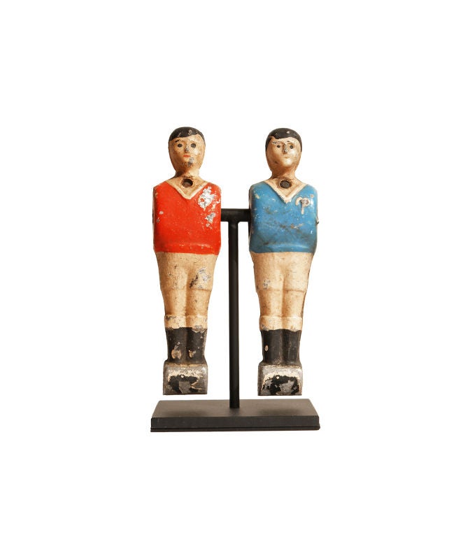 Dressed in red and blue, these wonderful Foosball players, with unique hand-painted faces, are presented on museum stands which allow them to swing. Please note that these are priced as each pair on a stand.  <br />
<br />
The Foosball table was
