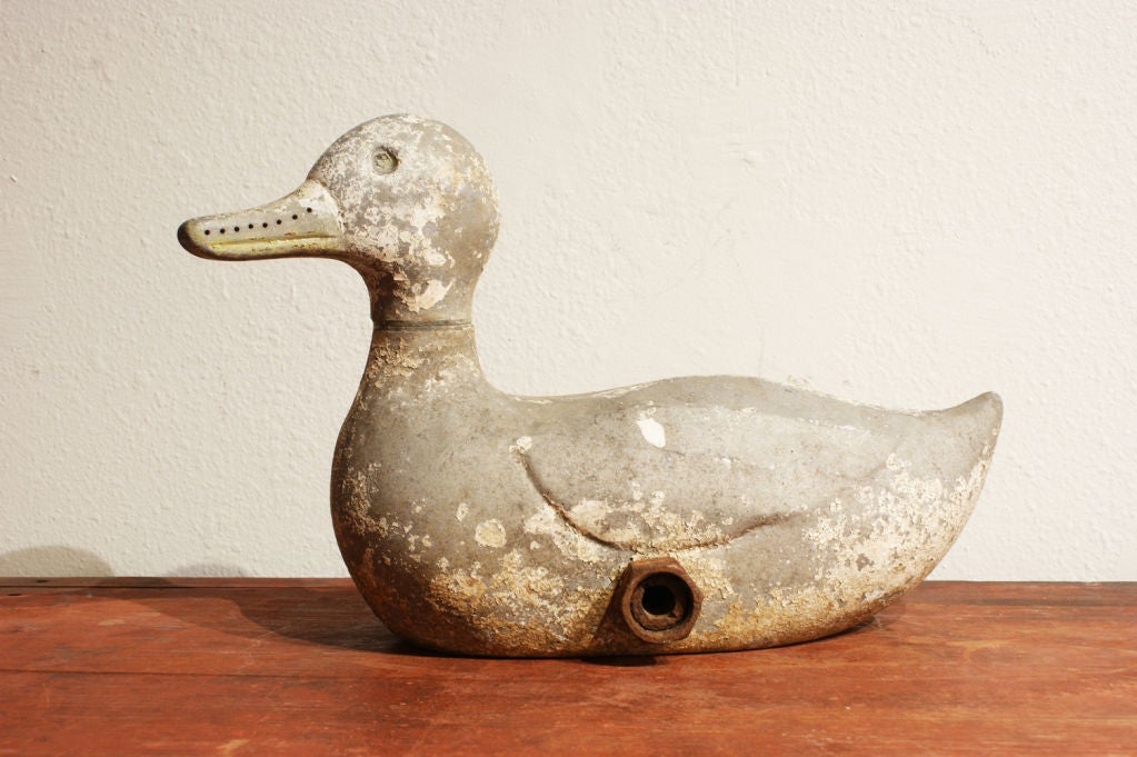 The head of this circa 1940s cast metal duck lawn sprinkler would spin as the water would shoot from holes along the top of the head and the beak.