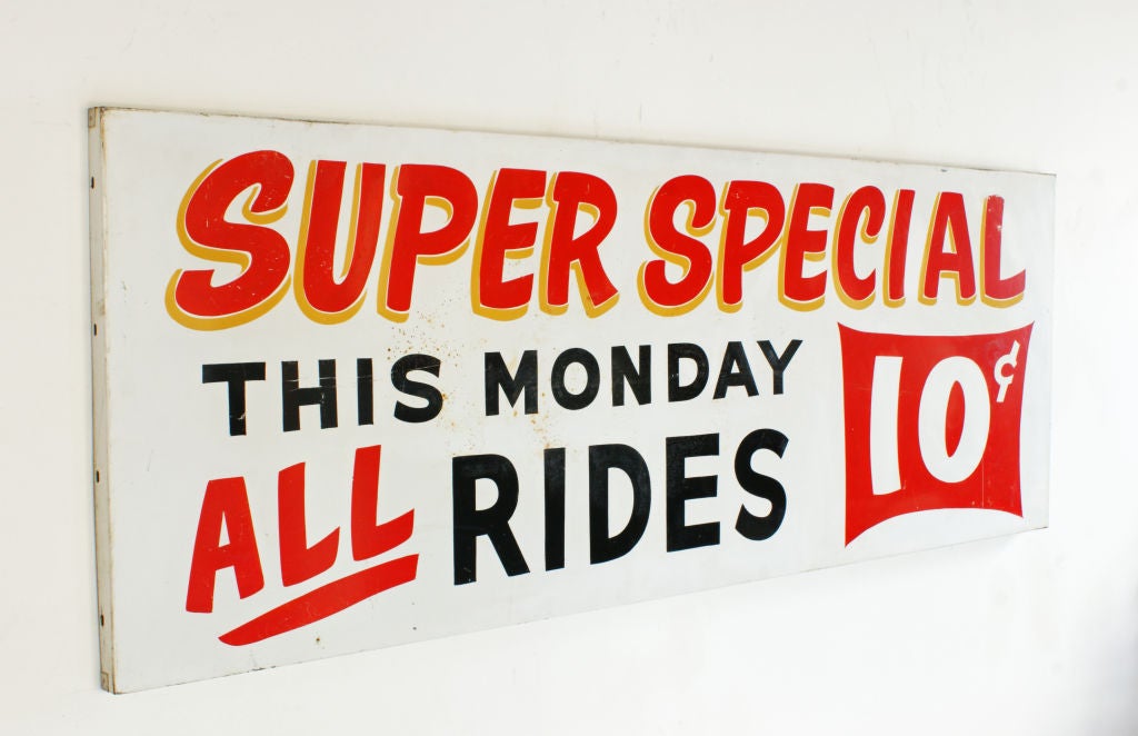 Bold and graphic enameled sheet metal sign from a mid century carnival midway.
