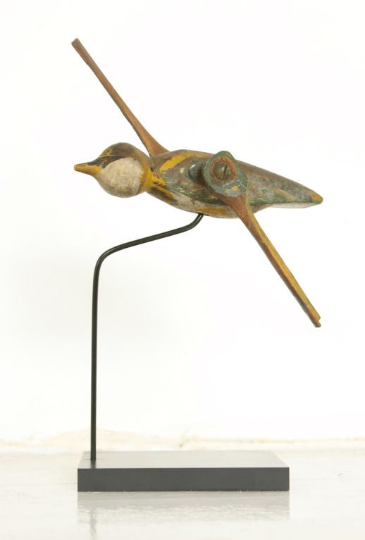 Turn of the century hummingbird whirligig with original paint surface. Found in New York State.