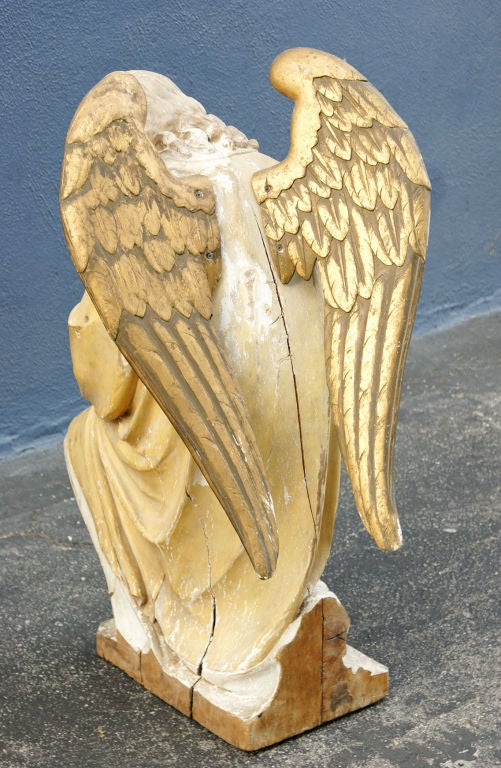 carved wooden angel statue