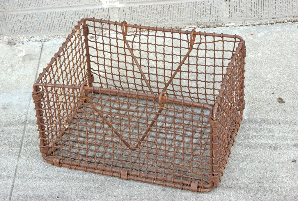 Heavy duty woven iron basket used in the Mississippi River.