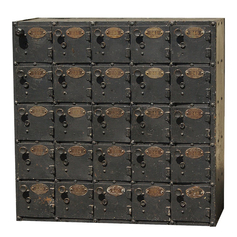 Very functional set of c. 1920's safe deposit boxes.  Sheet metal and iron construction with original brass number tags .  Manufactured by Terrell's Equipment Co. in Grand Rapids, Michigan.  Great storage piece.  Could work hanging on a wall or on a