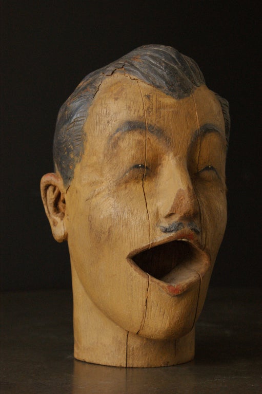 Finely featured carved man's head found in the southern United States. Most likely a late 19th century carnival head featured in a ball or ring toss game.