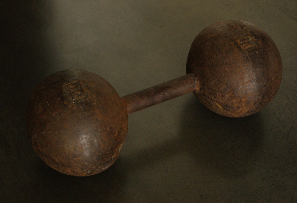 York strongman dumbbell, circa 1930s. Fantastic bookshelf curio. York Barbell founder, Bob Hoffman, began shaping the fitness industry in 1932. York Barbell was a driving force behind the United States Olympic Teams.
