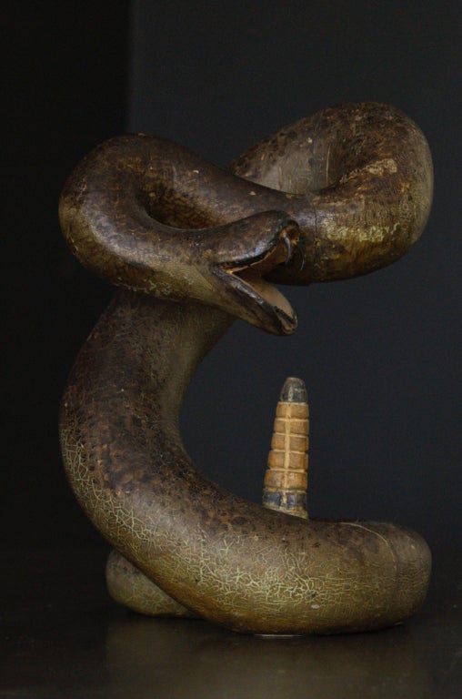 Excellent American Folk Art carved rattle snake. Posed to strike. Great carving detail from the rattlers to the fangs. Superb original paint surface showing perfect age and alligatoring. Constructed and carved from four pieces of wood. Please see