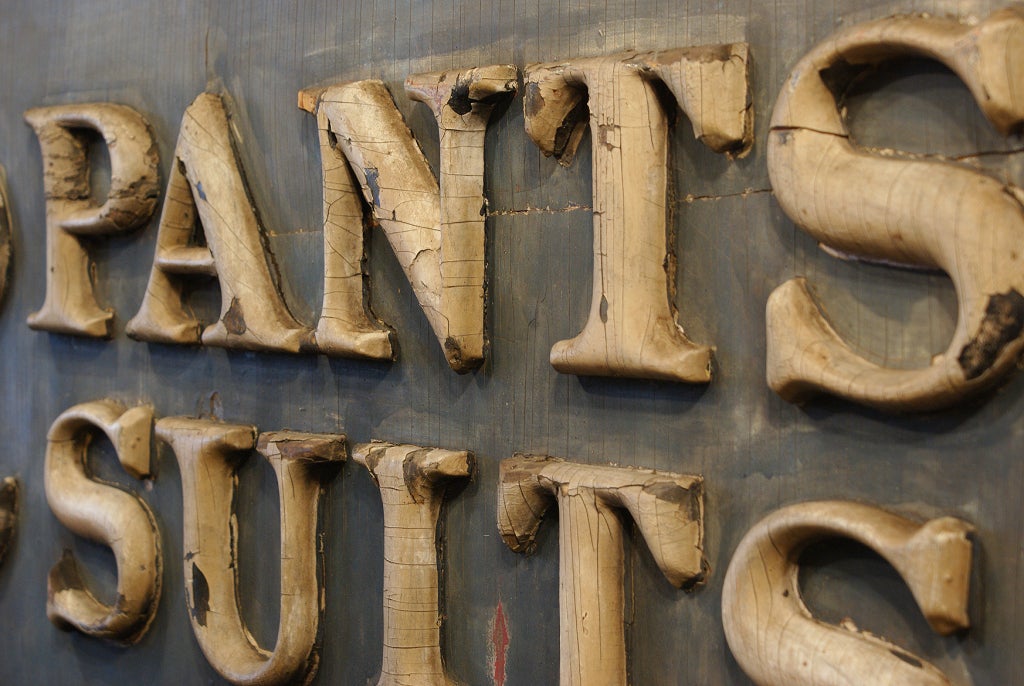 Three dimensional wood sign from Victorian era men's clothing store. Fantastic original paint surface. Faded gold letters and numbers on a faded cobalt background.