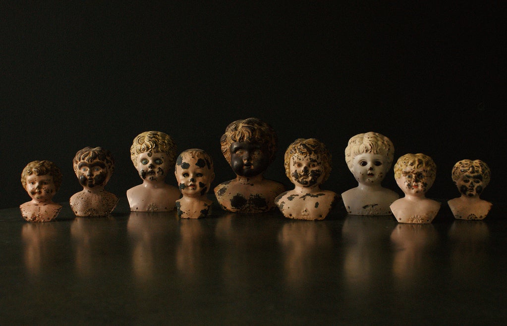Collection Of Graduated Tin Doll Heads