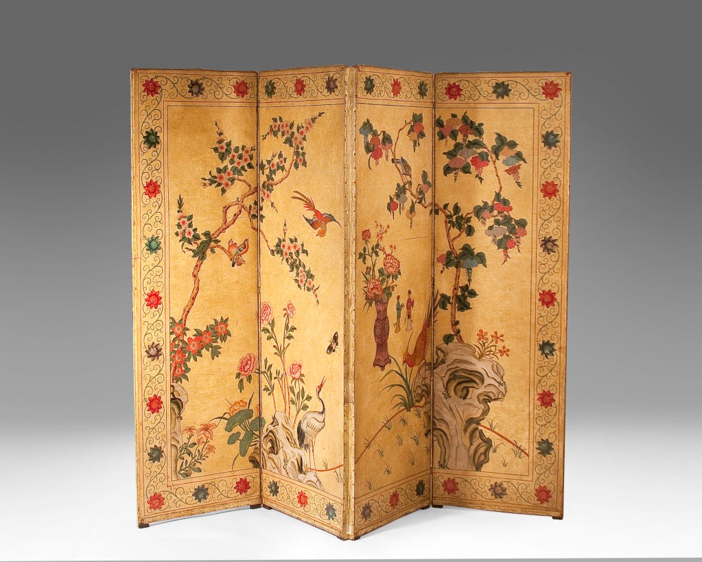 An impressive four-panel painted leather screen with polychrome chinoiserie pattern on a yellow background on one side and a polychrome painted floral pattern on a black background of the other.