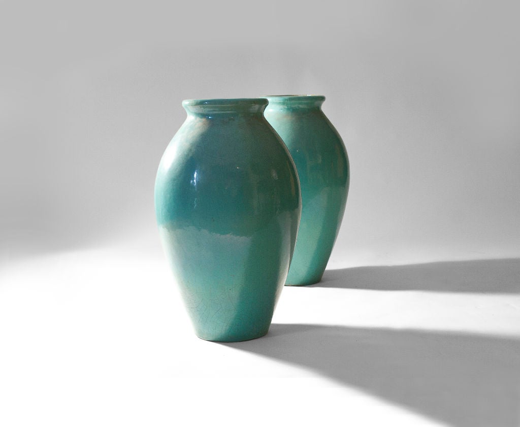 Pair of Galloway Glazed Urns with Excellent Verdigris Patina