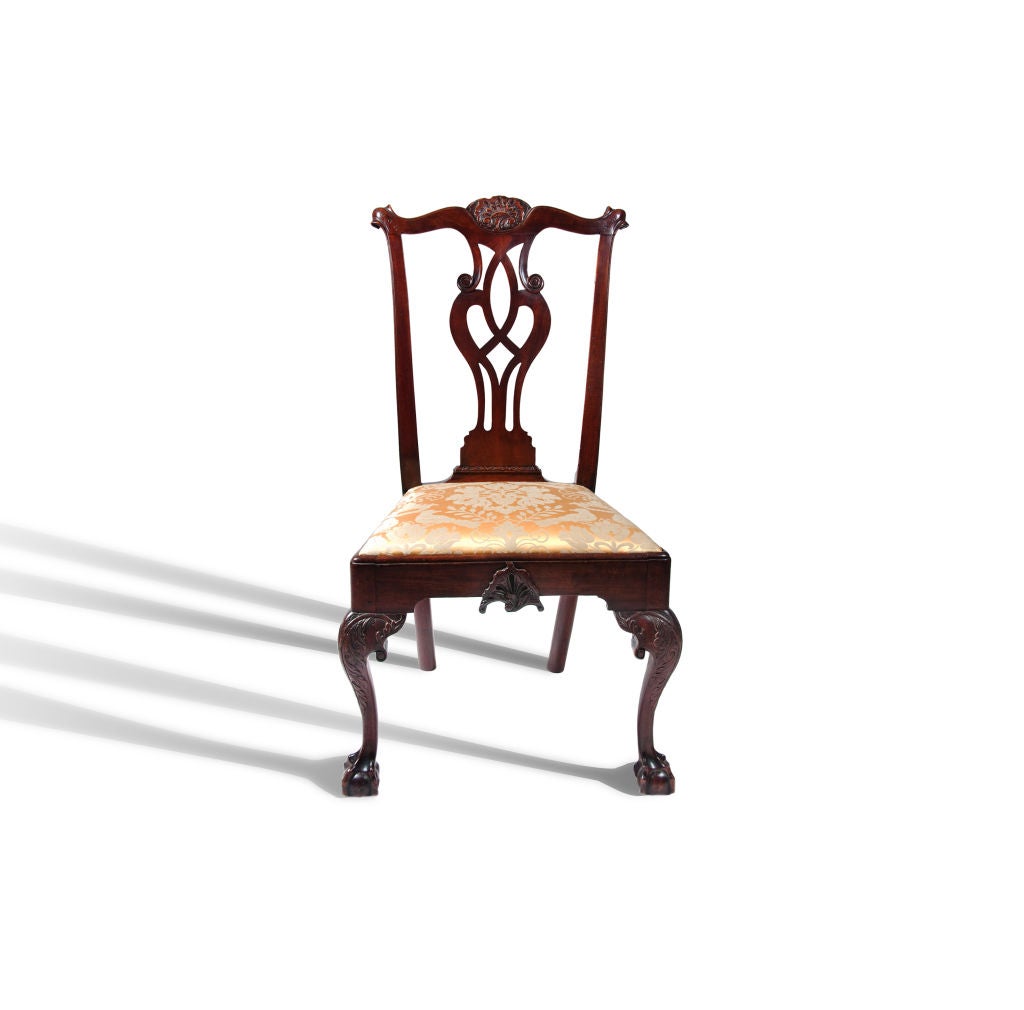 An exceptional example of a Philadelphia side chair.  Pictured in Horner's Blue Book (plate #71, p. 153) and American Chairs by John Kirk (plate #68, p. 79), this side chair has a cupid's bow crest with nicely carved cabochon in the center, a