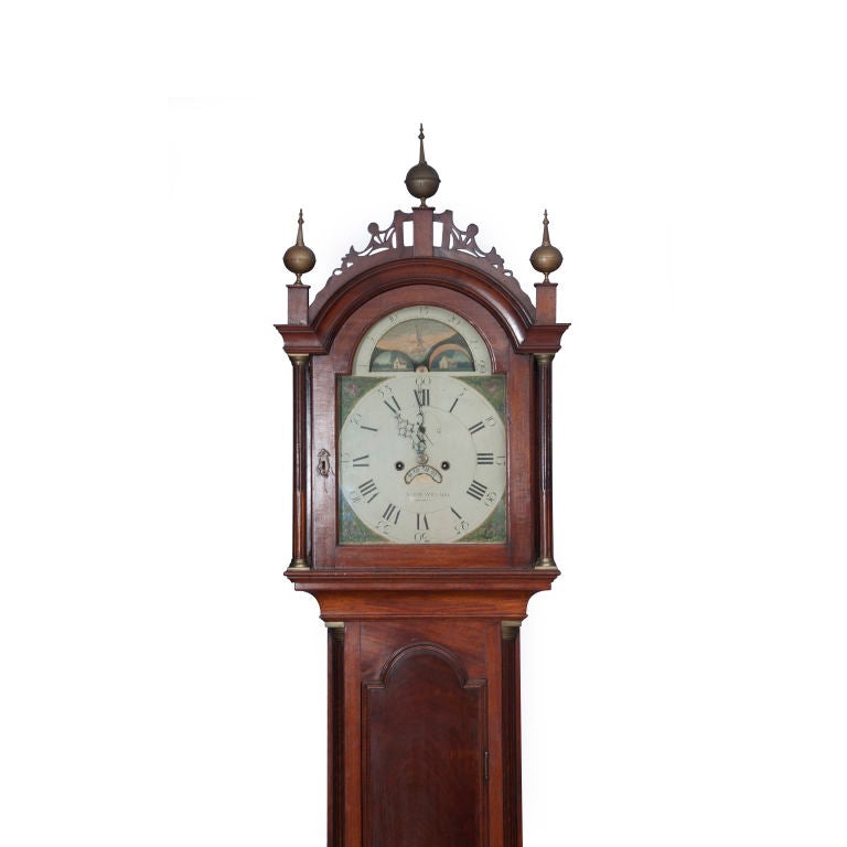 Retaining its original fretwork and brass finials, this elegant tall case clock displays a dial inscribed “AARON WILLARD” and his label engraved by Paul Revere attached to the inside of the waist door with instructions on how to wind it. It is of