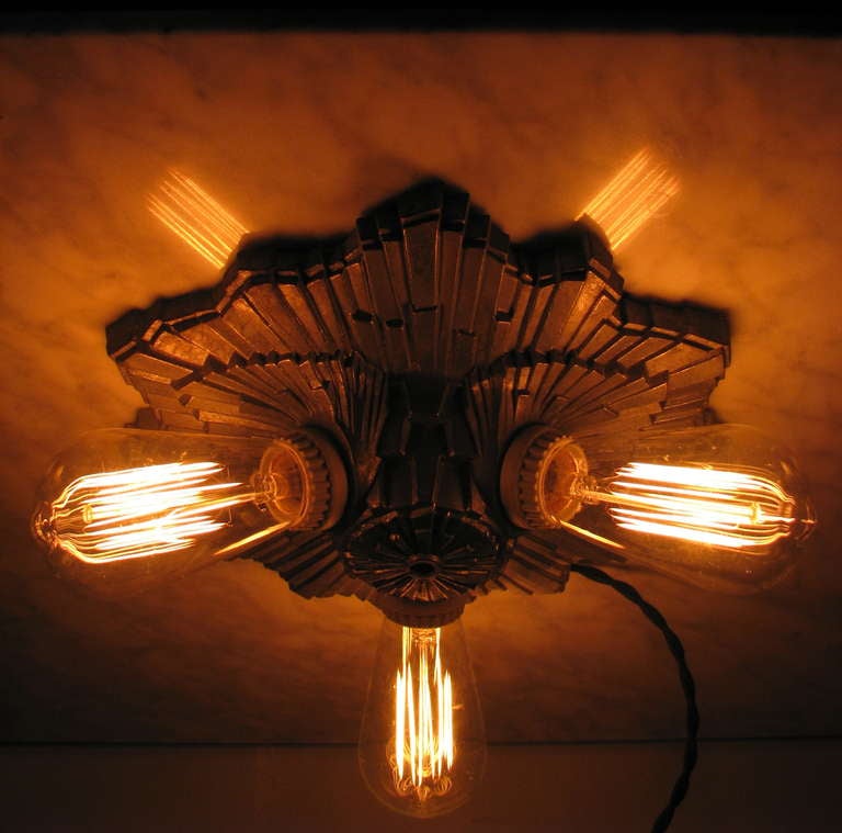 Bronze Sunburst Wall or Ceiling Mounted Art Deco Theater Sconce. Can also be installed as a drop light with rod length to order. Newly rewired. Porcelain sockets and cloth cord.