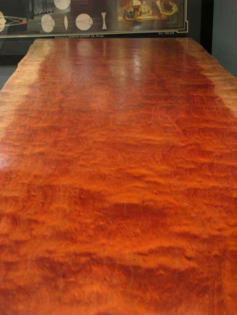 Large Single Slab Table 
Gorgeous Live Edge African Bubinga Table with modern chrome propeller table bases. Long dramatic two-tone coloring.

Heir Antiques- specializing in folk art, industrial, rustic modern, vintage lighting, victorian era and