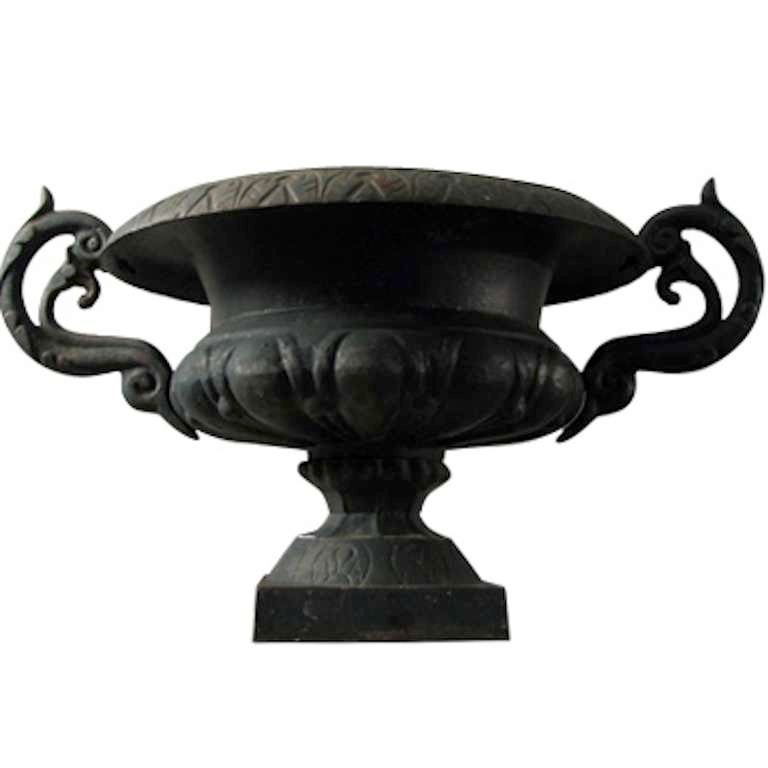 Massive Pair of Ornate Cast Iron Urns
classical style, from an estate in Watch Hill Rhode Isalnd
gracious loving cup handles and wide deep bowl able to accommodate large plantings and arrangements