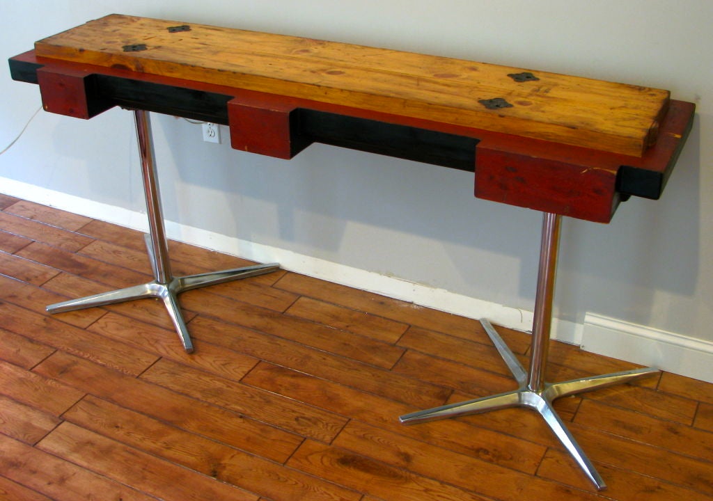 Graphic Industrial Wooden Foundry Pattern with Steel propeller legs. original red and black painted surface and refinished raw wood top. A clear aesthetic link to Gerrit Rietveld's work is apparent.