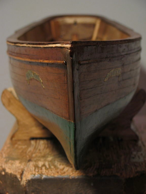 Elegant and incredibly large full bodied hull of a hand built wooden boat. green painted bottom and beautiful detailing. 