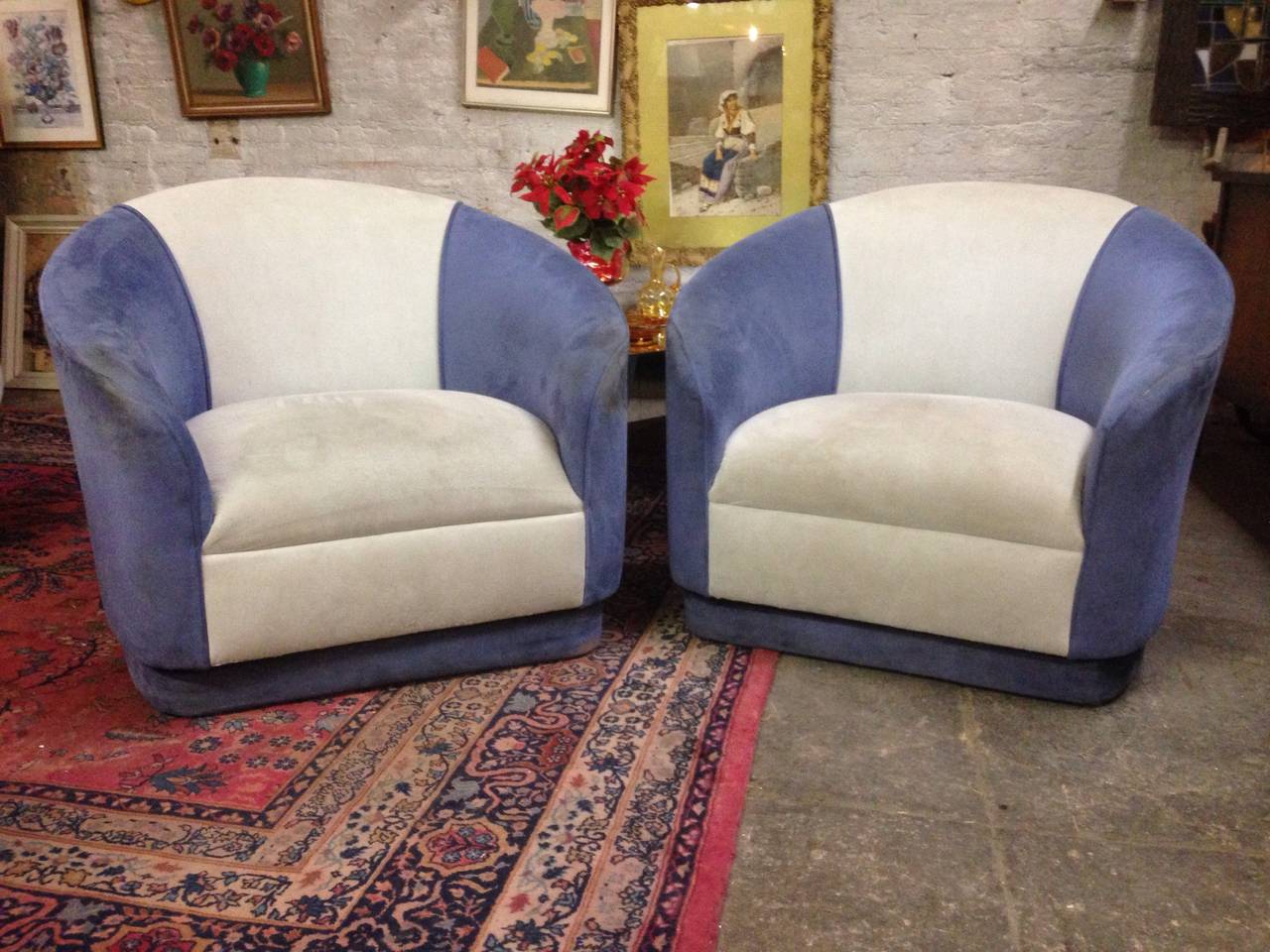Pair of signed swivel barrel chairs.