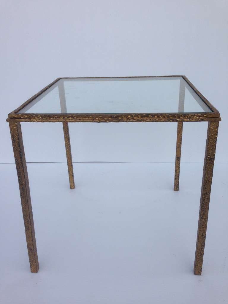 Petit Brutalist table in gold gilt.