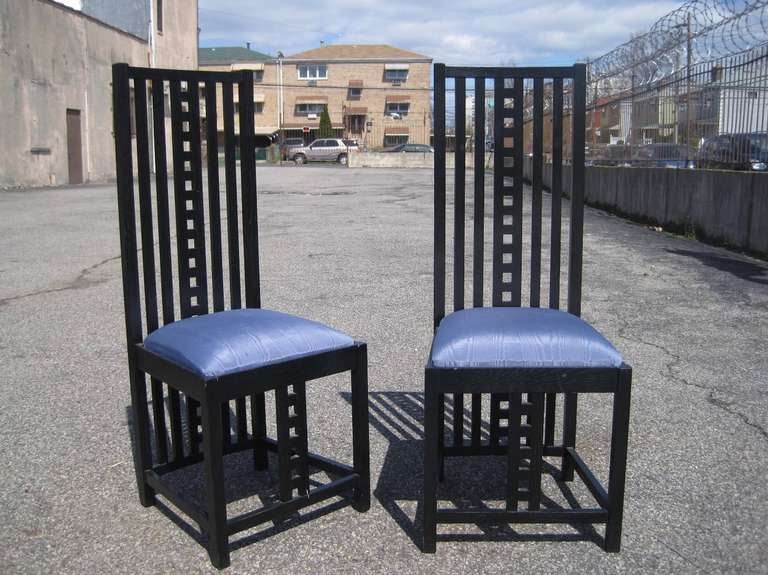 Set of four Charles Rennie Mackintosh curved back tall chairs, newer edition reproduction, these items are on sale for a clearance price.