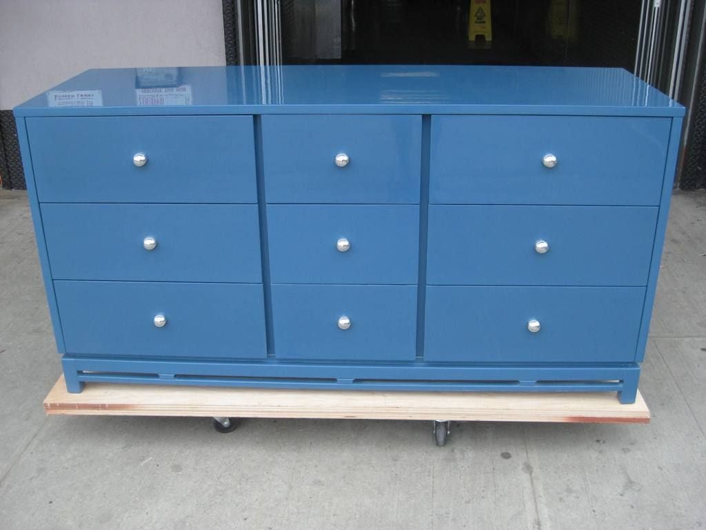 Signed Blue Lacquer Modernist 9 Drawer Dresser, This High Style Mid Century Modern Age Chest of Drawers, has Subtle Asian Influences in the Fretwork below the Reveal, Built into the Base for Reinforcment and Beauty, Exceptional Craftsmanship and