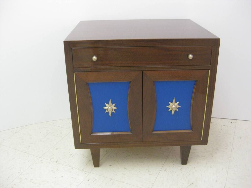 Pair of Sapphire Blue Leatherette, Which Can Be Easily Changed To a Number of Different Colors Bedside / End Tables in the manner of Renzo Rutili for Johnson Furniture Company, These  Mid Century Modern Side Table / Night Stands Are Of Hollywood
