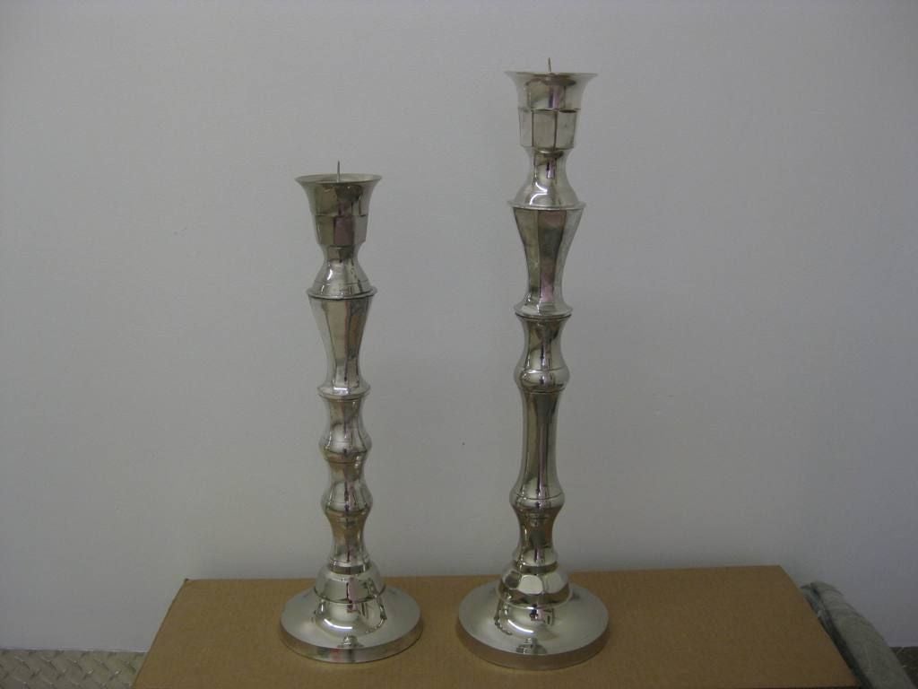 Pair of silver candelabras, These Hollywood Regency candelabras are available as single candlesticks or a pair of candleholders. 