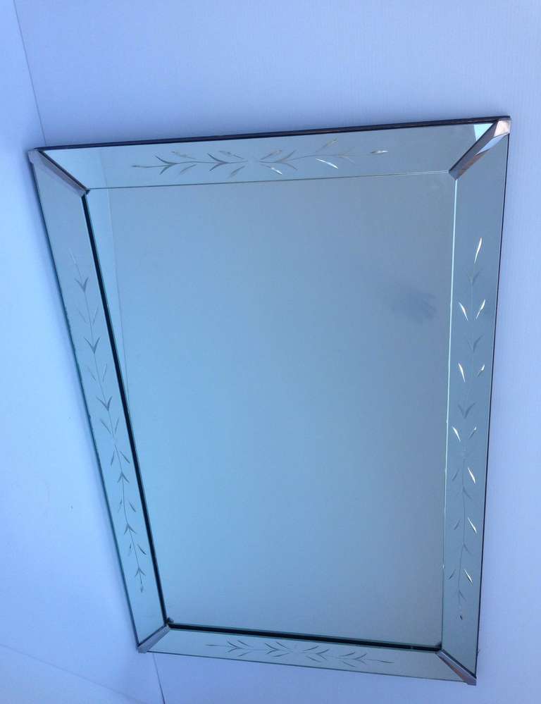 Clean lined reverse etched medium size mirror, can be hung vertical or horizontal.
