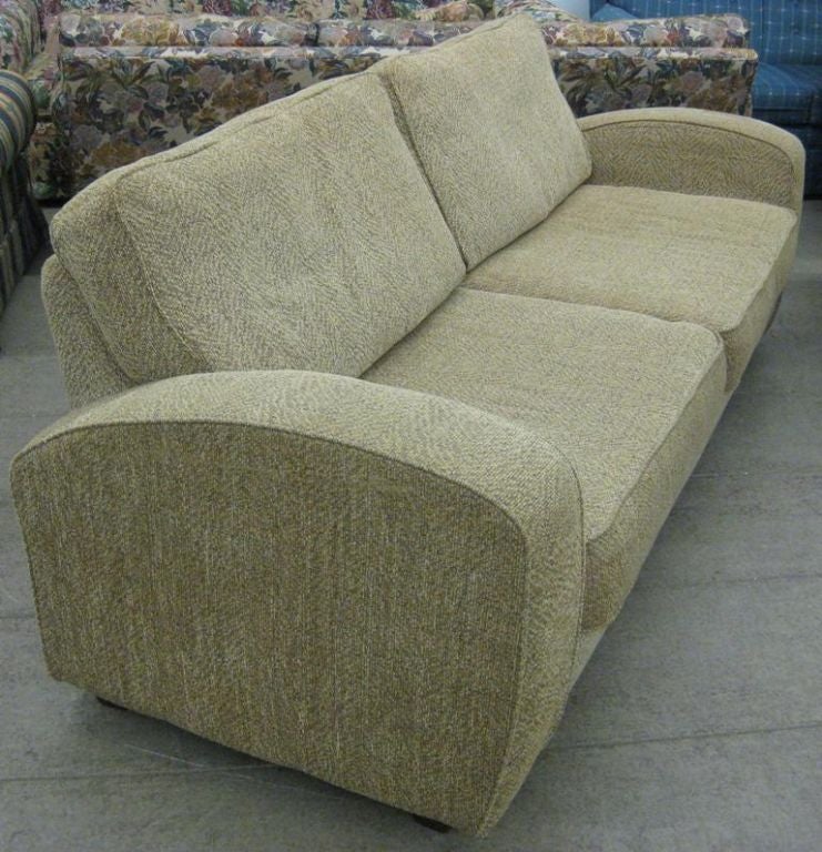 Art Deco / Modern Sofa after Paul Frankl, Jacques Adnet, this four seat couch is in the twin cushion speed chair style, we can upholster this item with your own fabric within approximately one week, complete new upholstery WCOF, all inclusive or