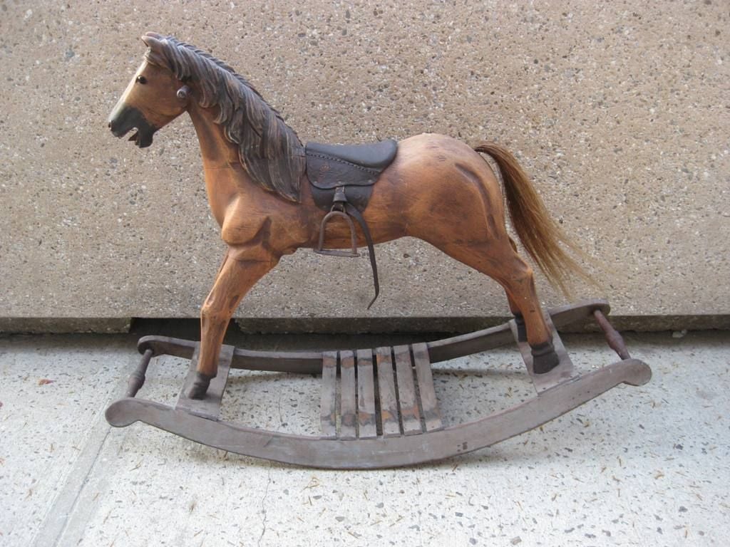 Large Wood Toy Rocking Horse, this child rocking horse is made with wood and horse hair for tail, please visit sjulian.1stdibs.com to see our collection, we provide rentals for stylists, photo shoot and props for movie sets.
