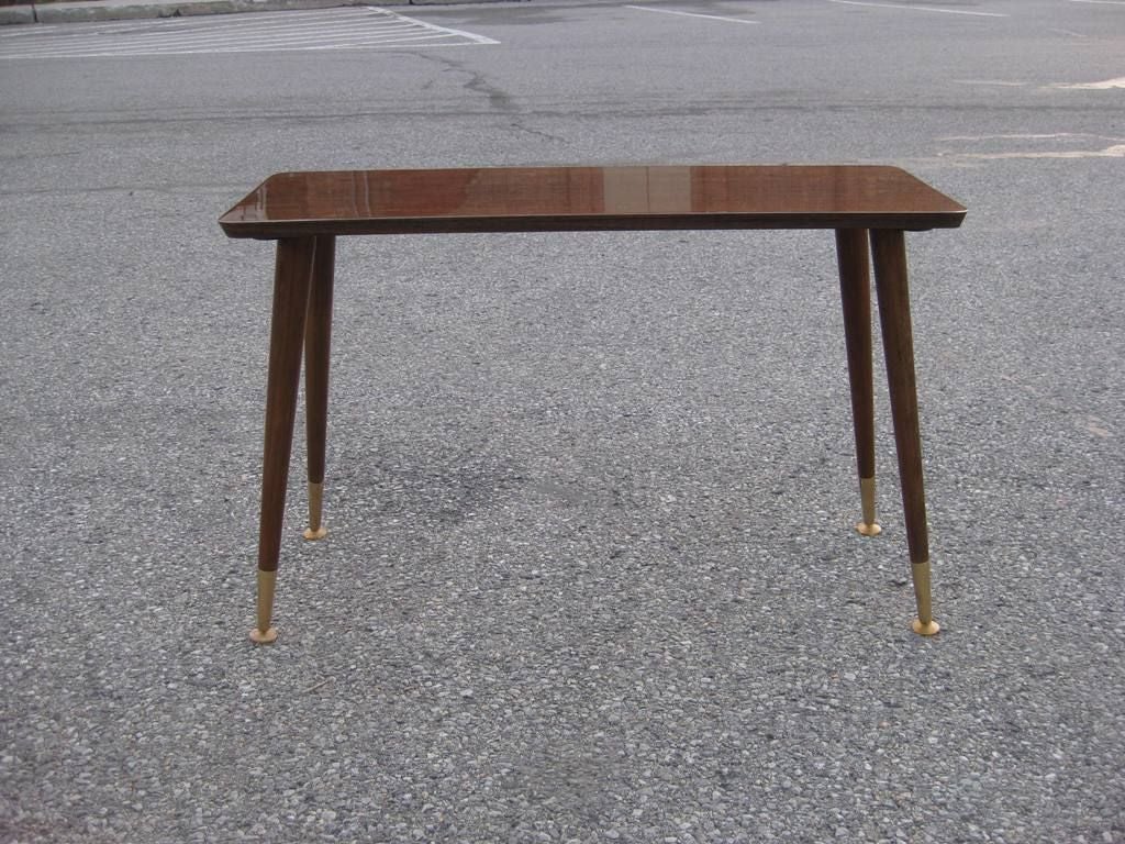 Pair of Mid-Century Modern shallow and long end or side tables after Paul McCobb, these legs can be easily attached vertical by unscrewing them, the actual table size then it will be 30.5